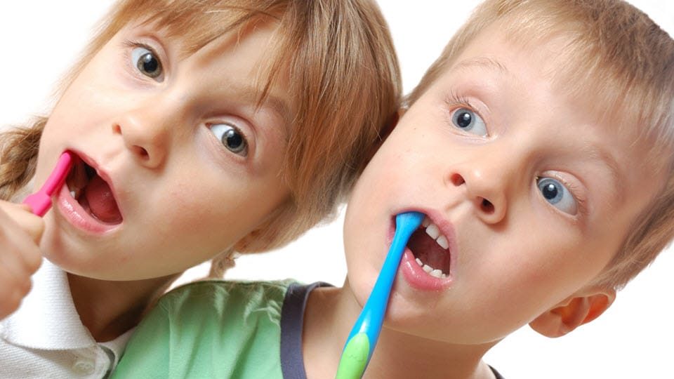 Children brushing their teeth