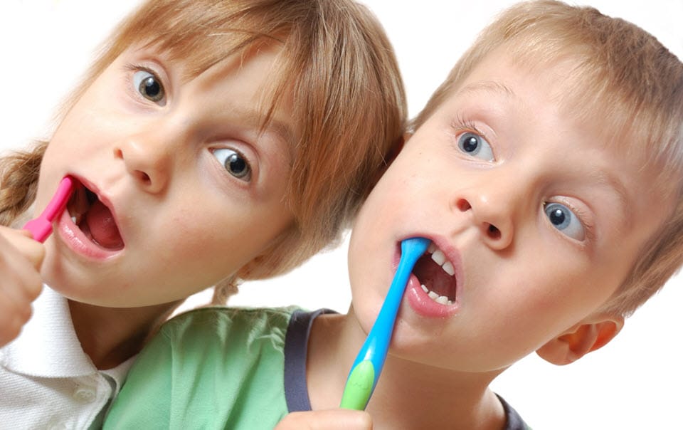 Children brushing their teeth